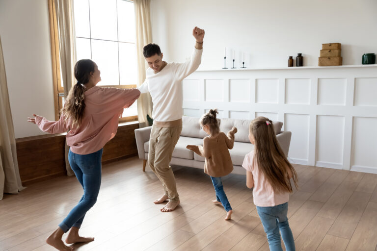 Parents dancing with their children