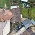 aerial view of a property and a car