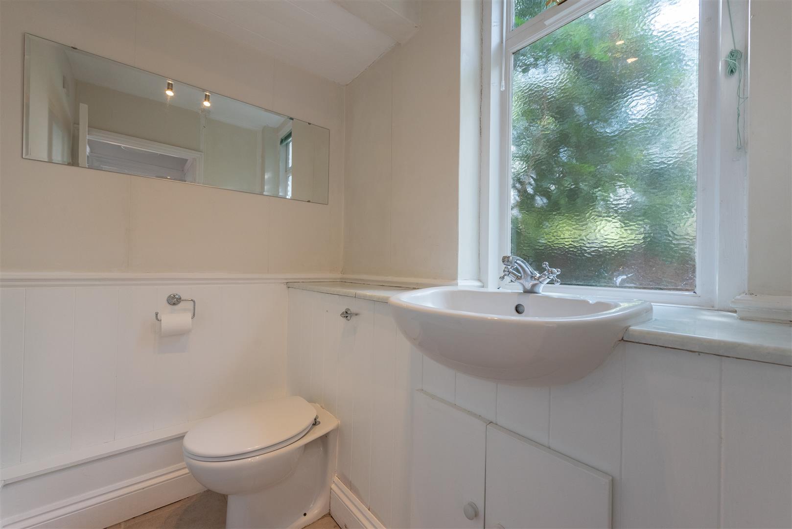 Inside view of a house bathroom along with a basin